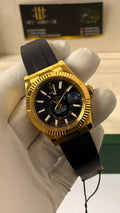 Yellow gold with black Dial.
