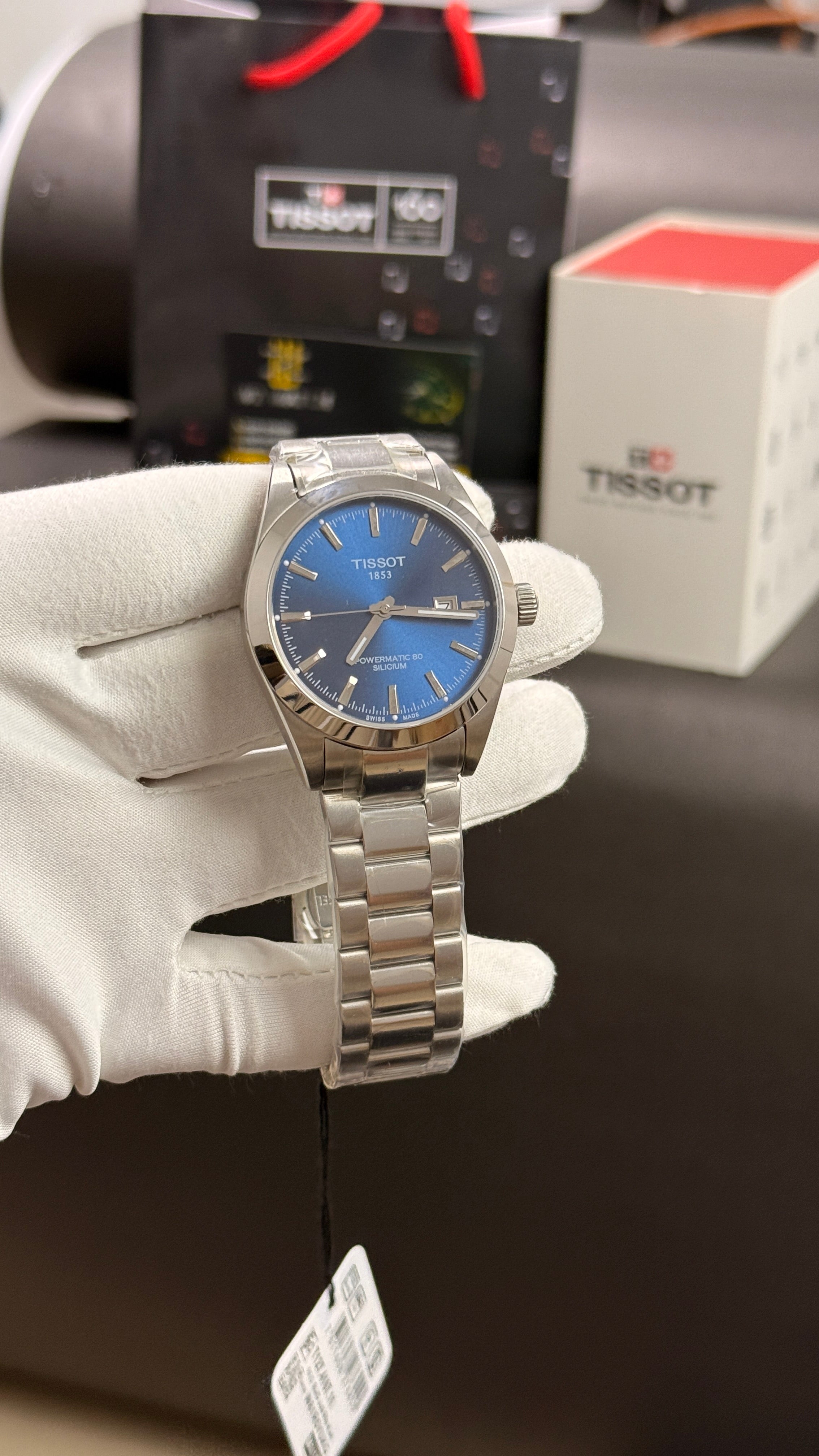 Silver with blue dial
