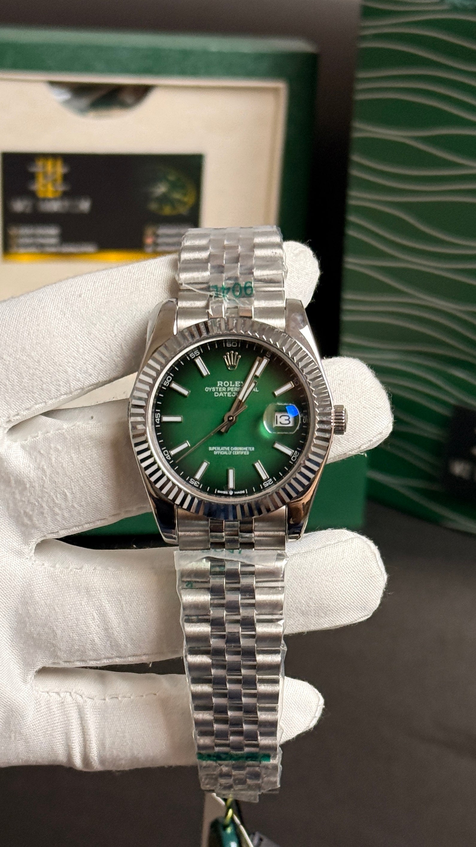 Silver with green Dial.