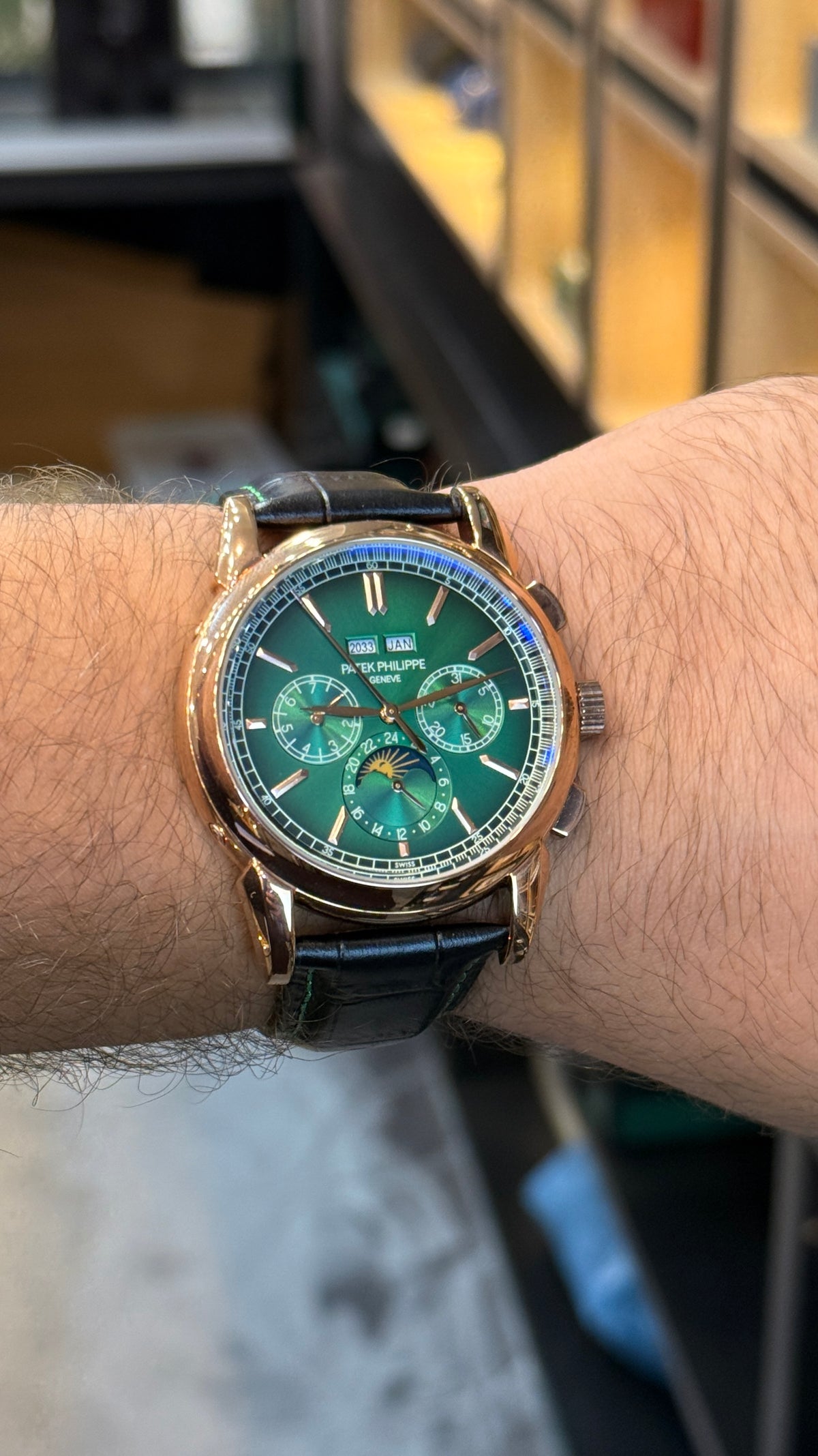Rose gold with green Dial.