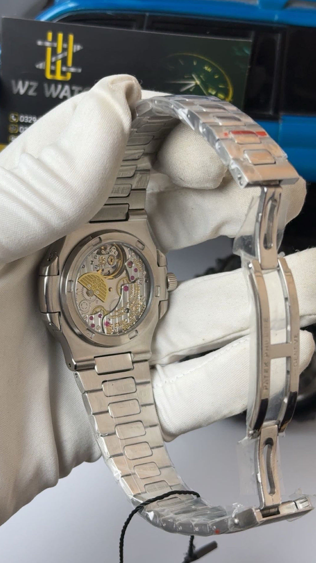Silver with blue Dial.