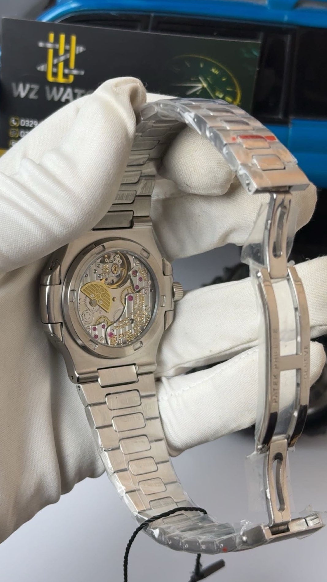 Silver with blue Dial.