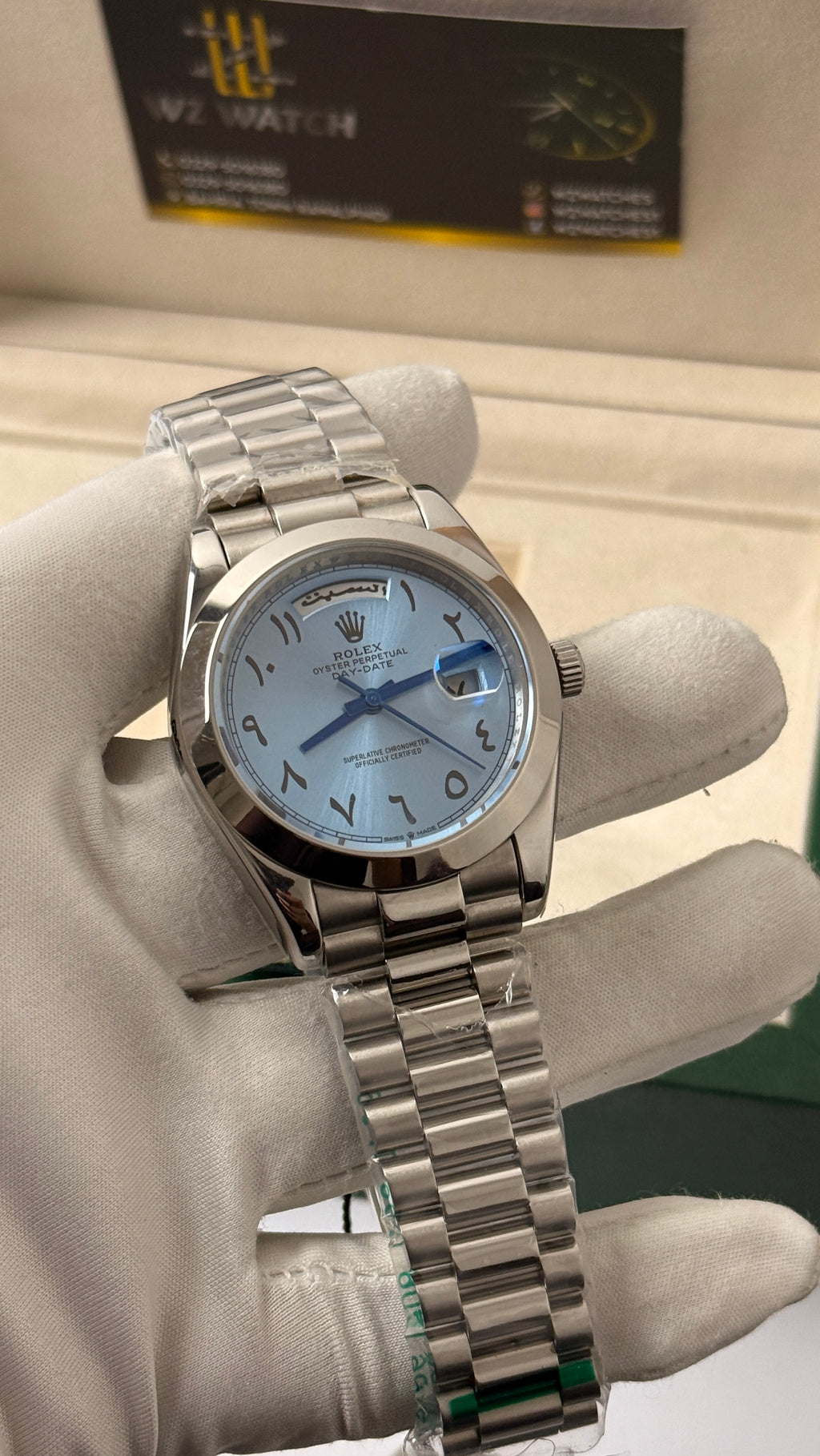Silver with blue Dial.