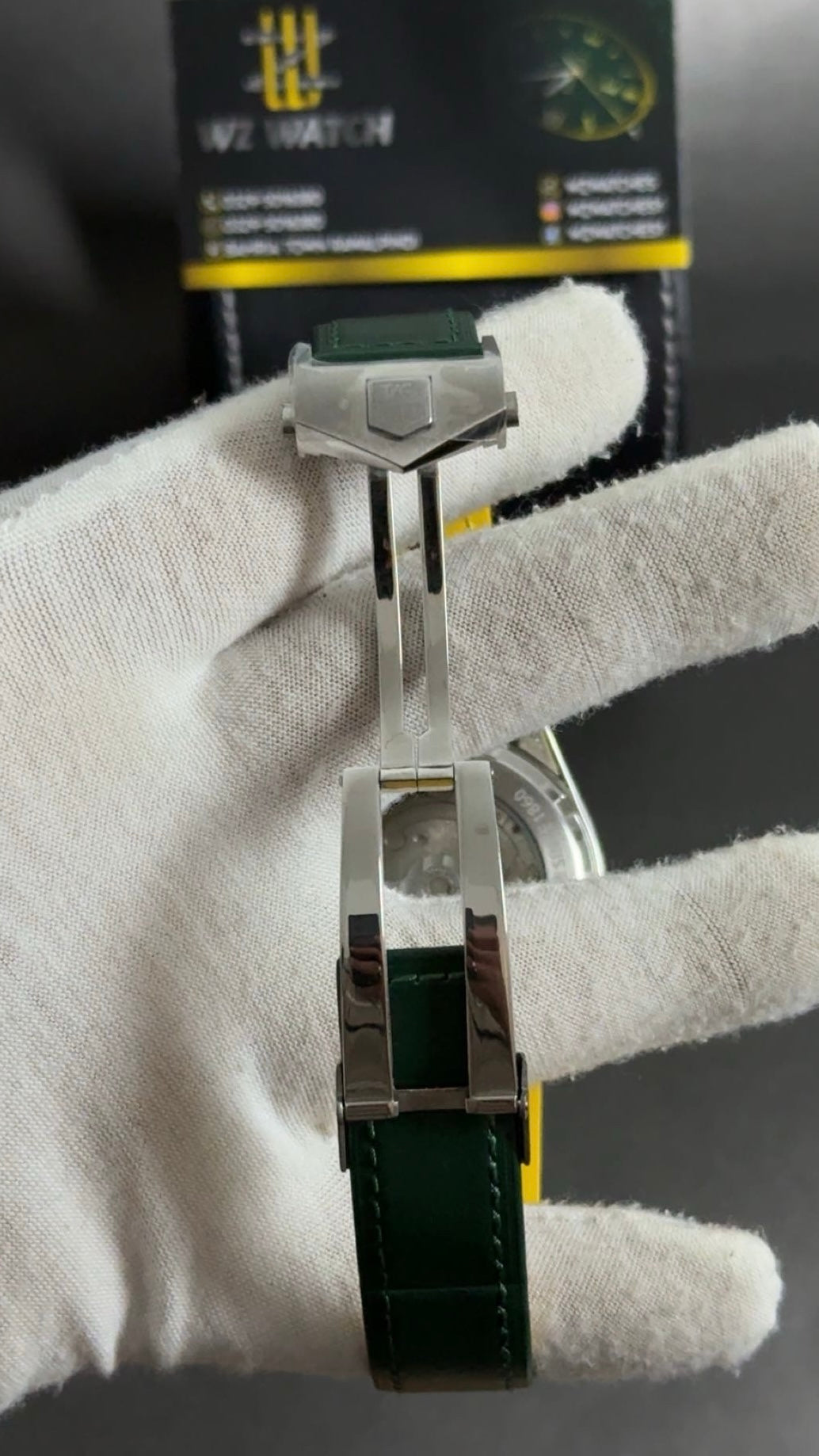 Silver with green Dial