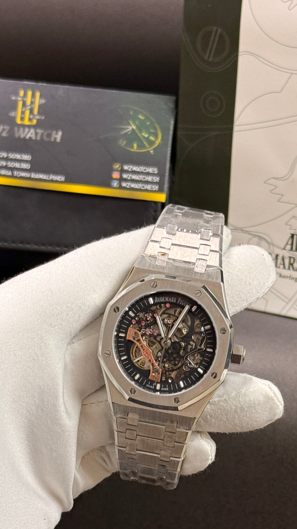 Silver with black skeleton dial