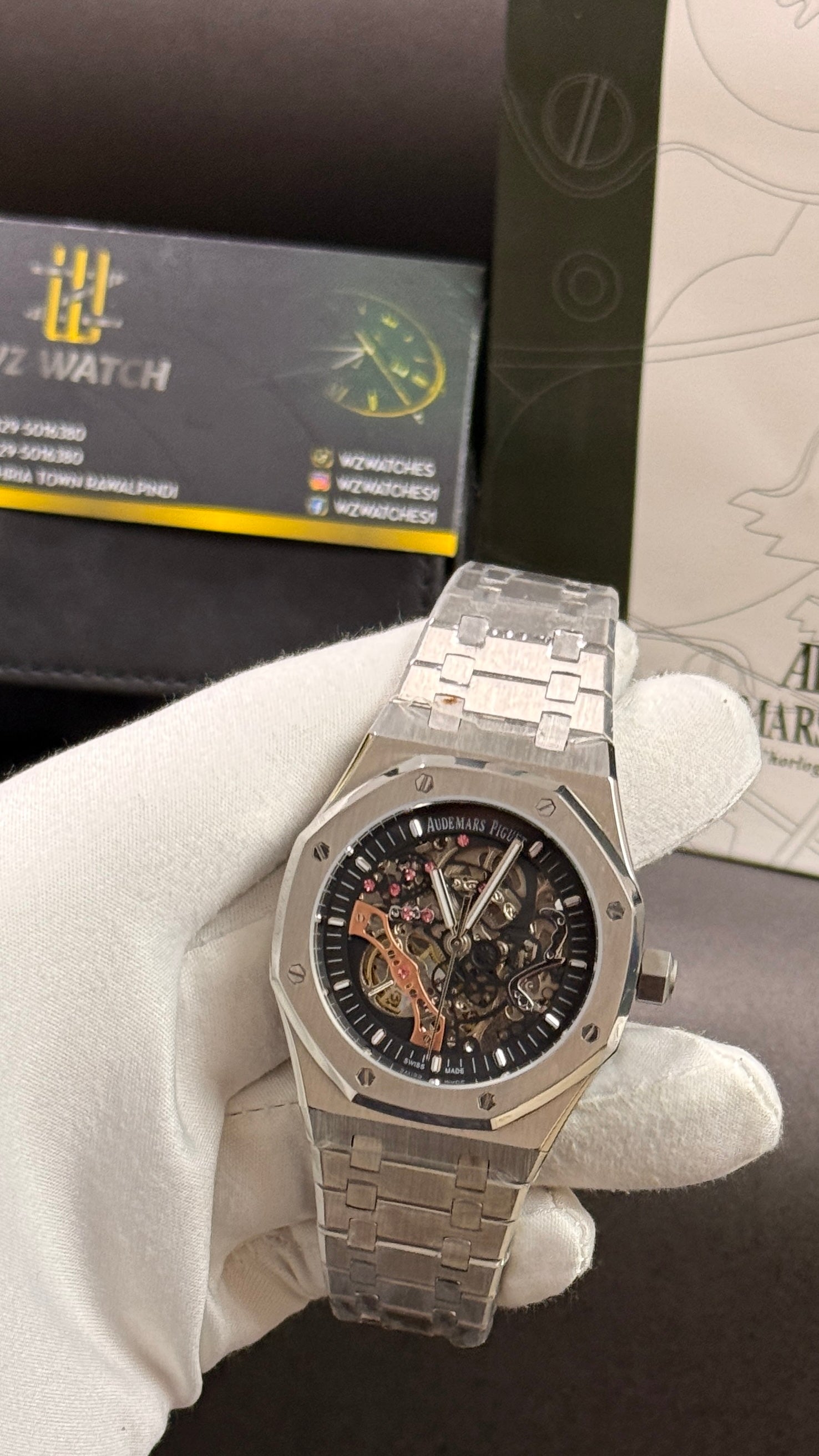 Silver with black skeleton dial