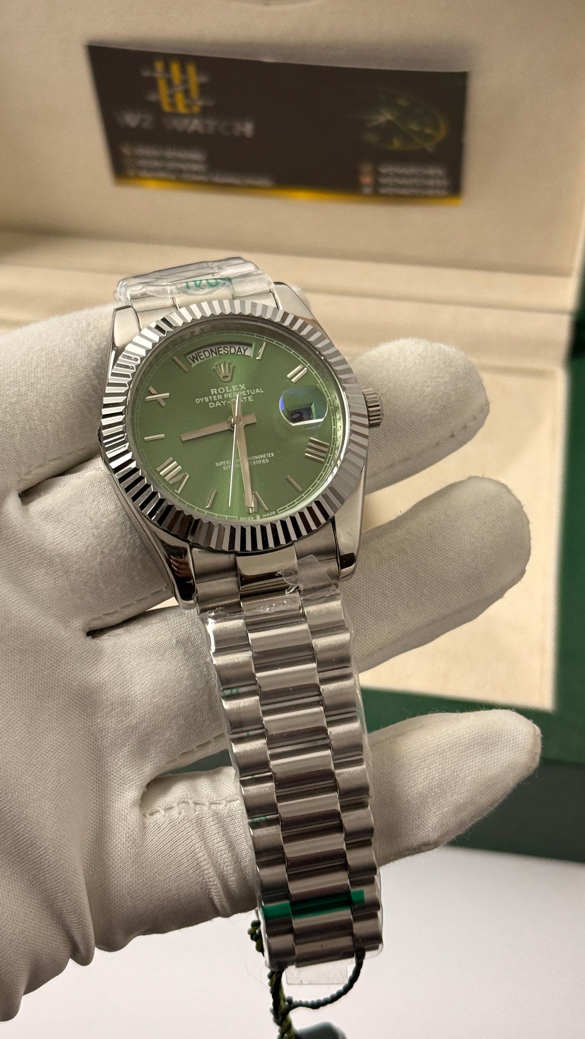 Silver with green Dial.