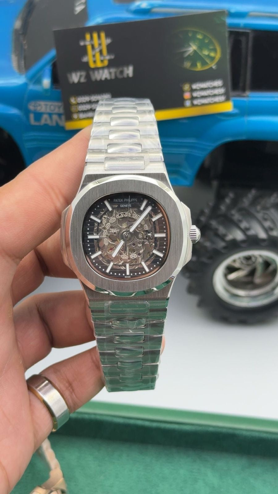 Silver with skeleton Dial.