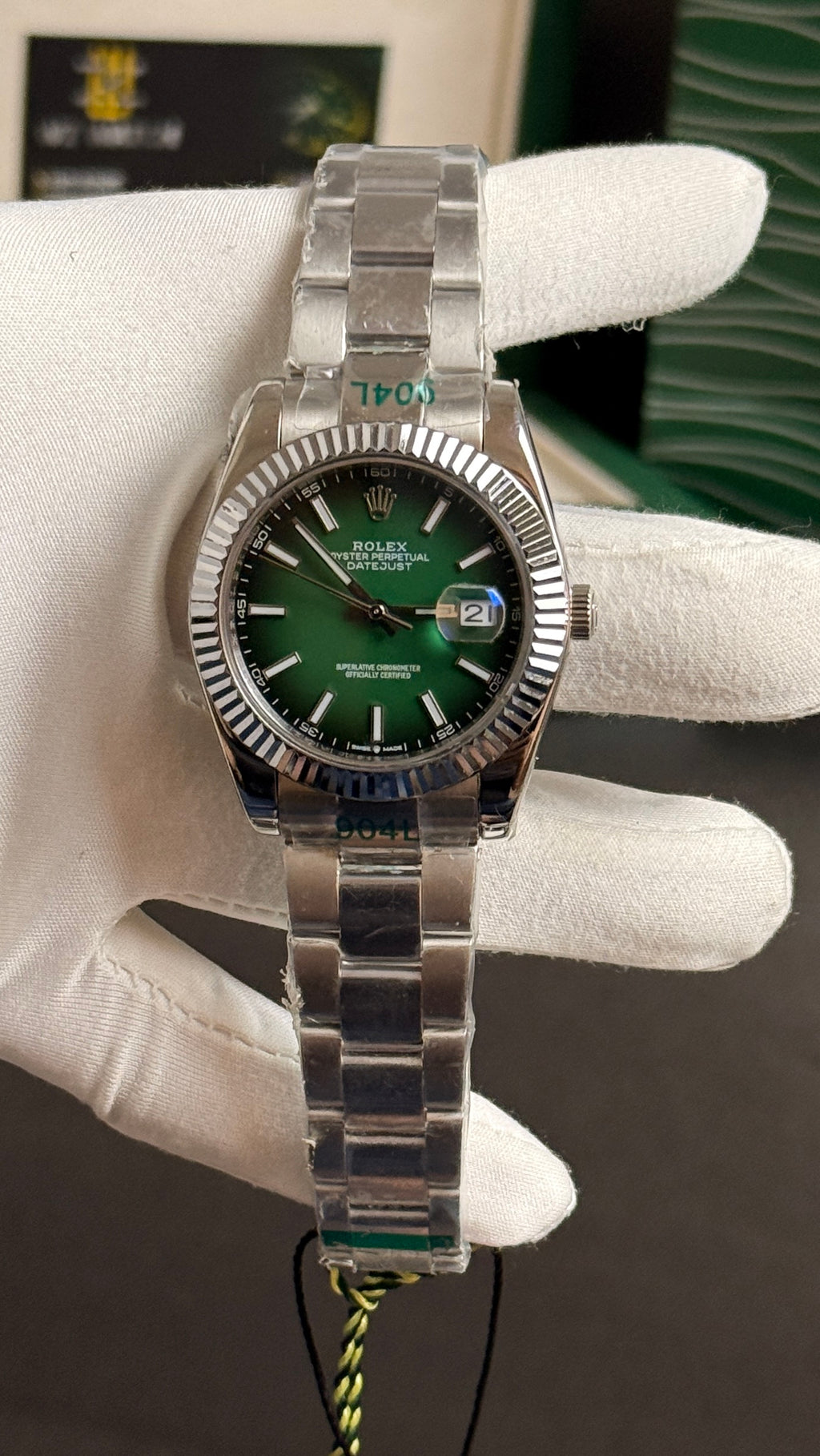 Silver with green Dial.