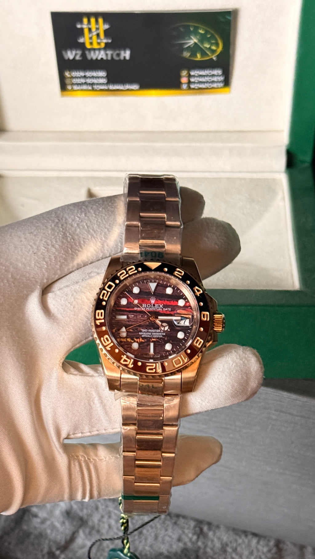 Rose gold with marble Dial.