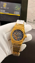 Yellow gold with blue skeleton dial