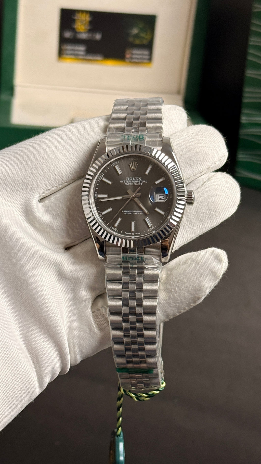 Silver with grey Dial.