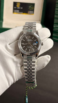 Silver with grey Dial.