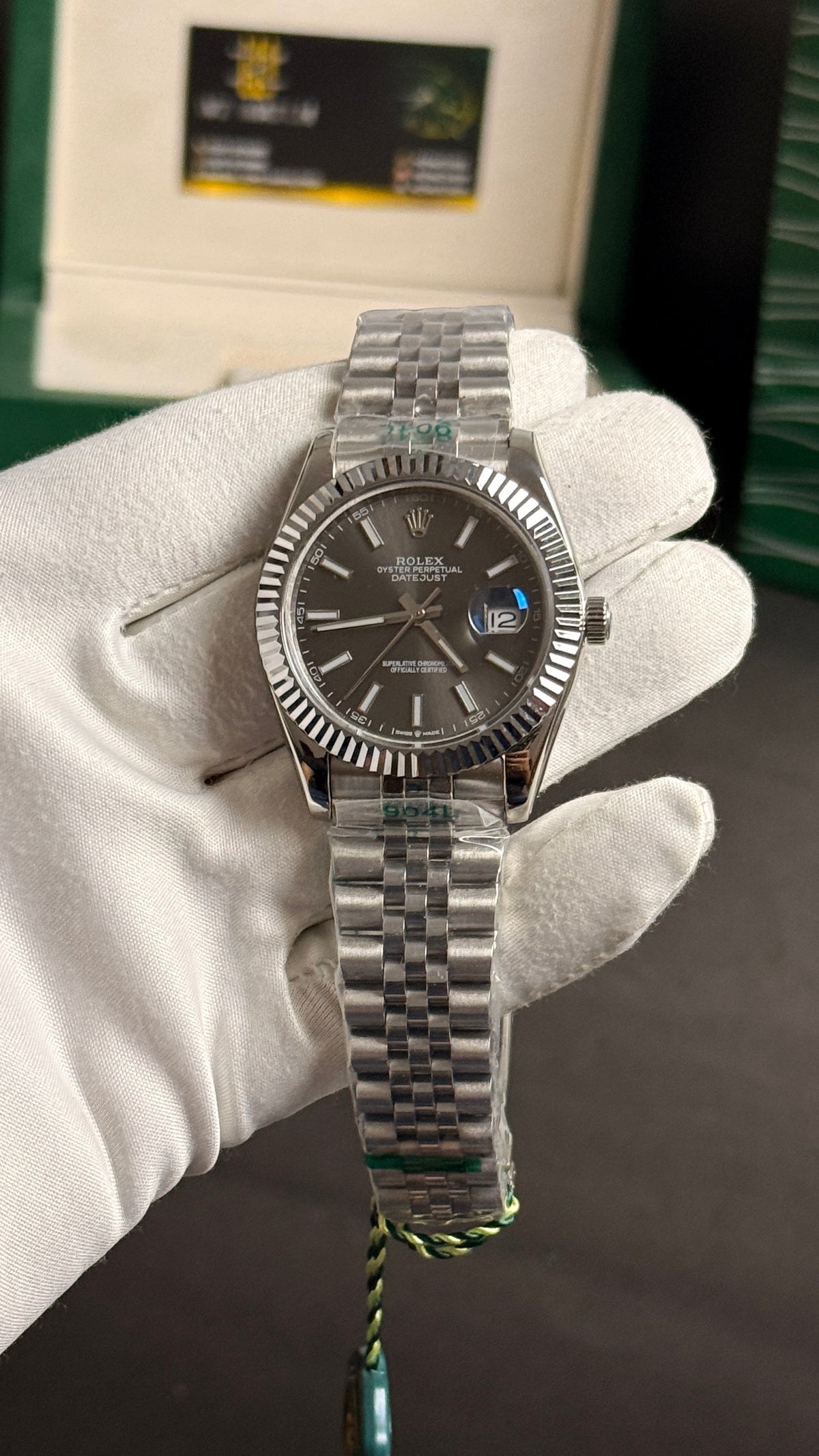 Silver with grey Dial.