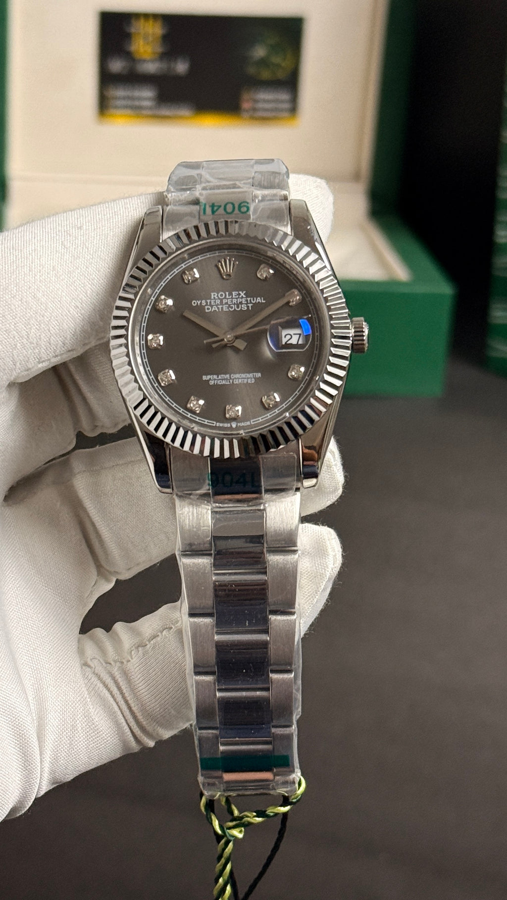Silver with grey Dial.