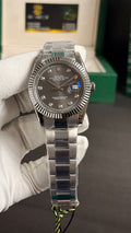 Silver with grey Dial.
