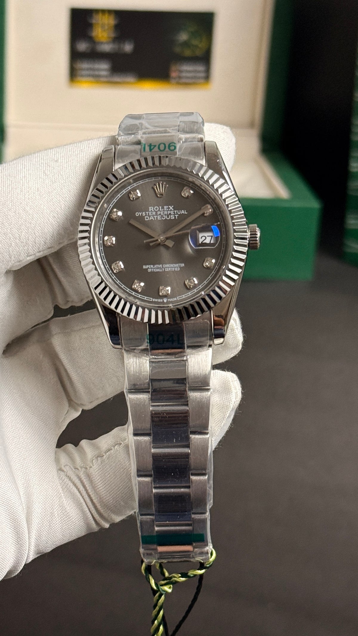 Silver with grey Dial.