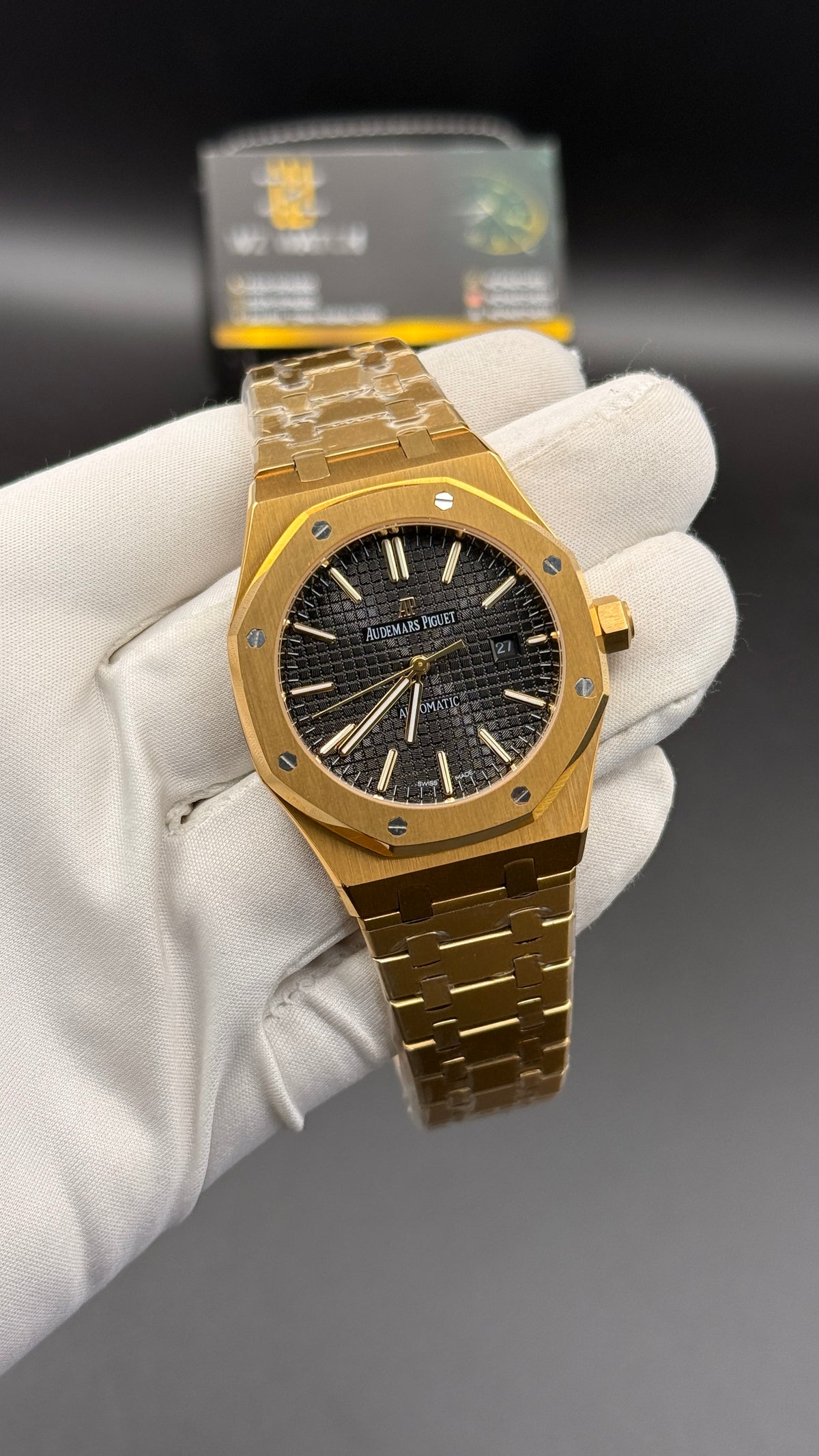 Yellow gold with black Dial.