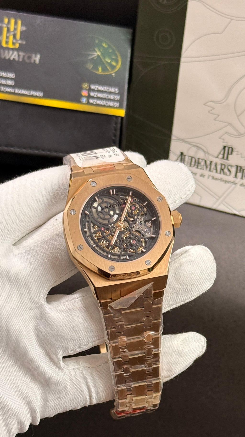 Rose gold with black skeleton dial