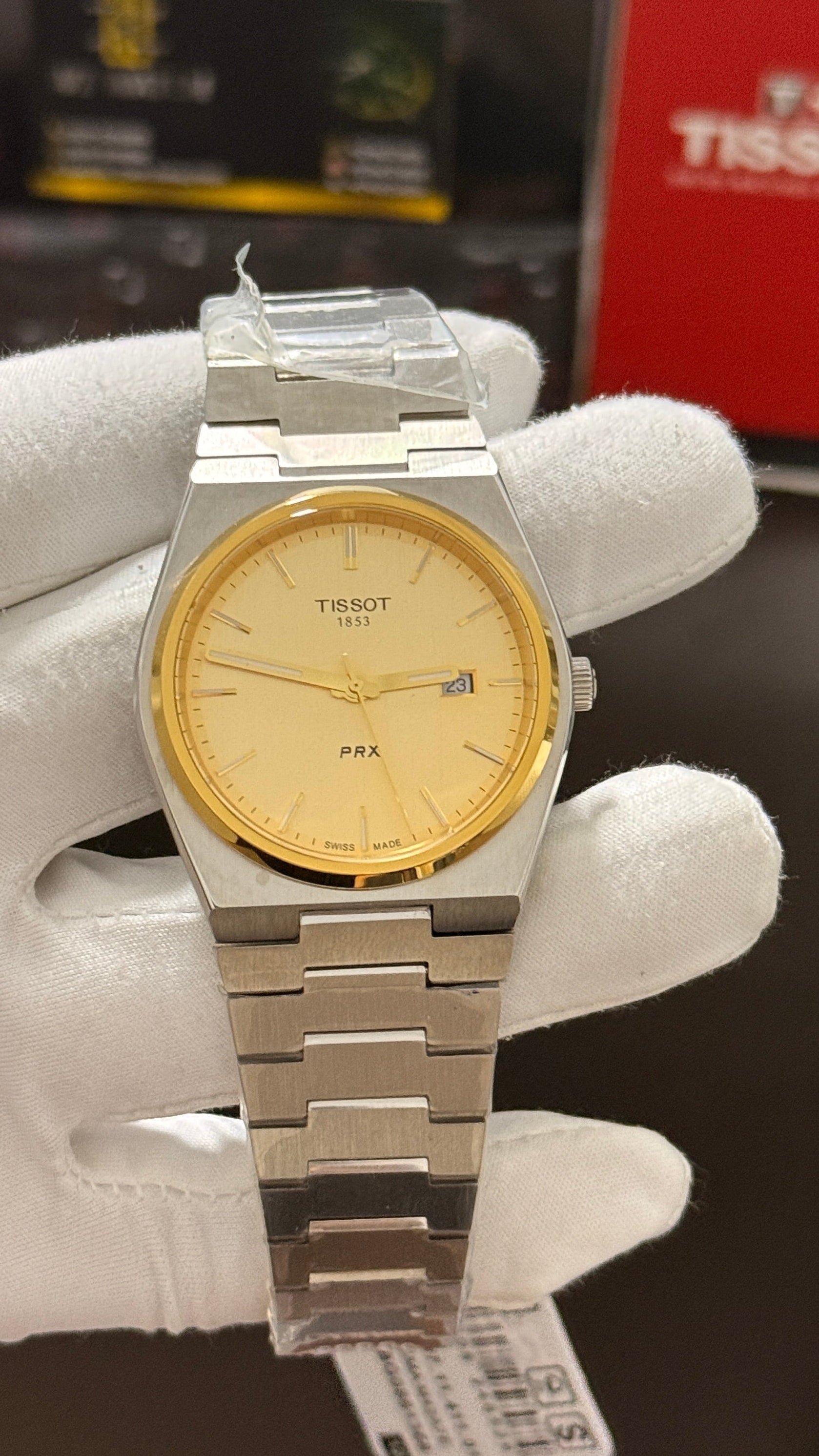 Silver with gold dial & gold bezel