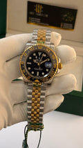 Yellow gold with two tone with black Dial.