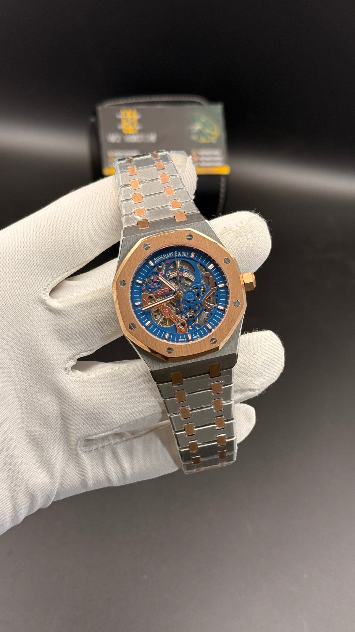 Rose gold two tone with blue skeleton Dial.