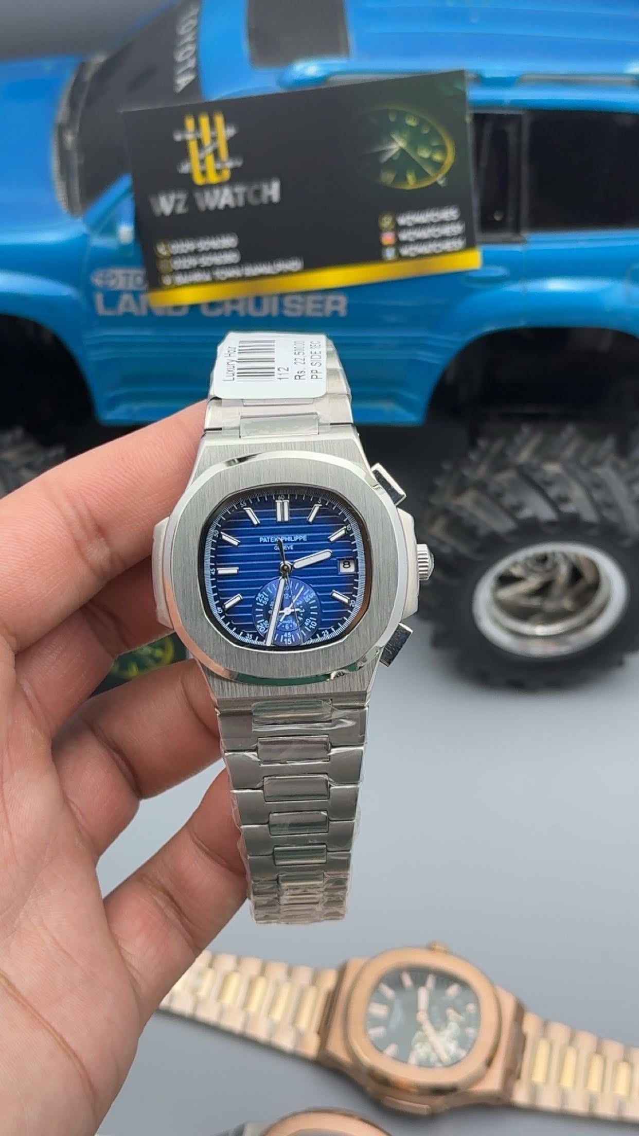 Silver with blue Dial.