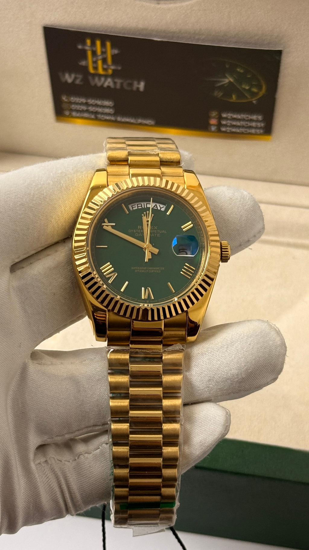 Yellow Gold with  Green Dial.