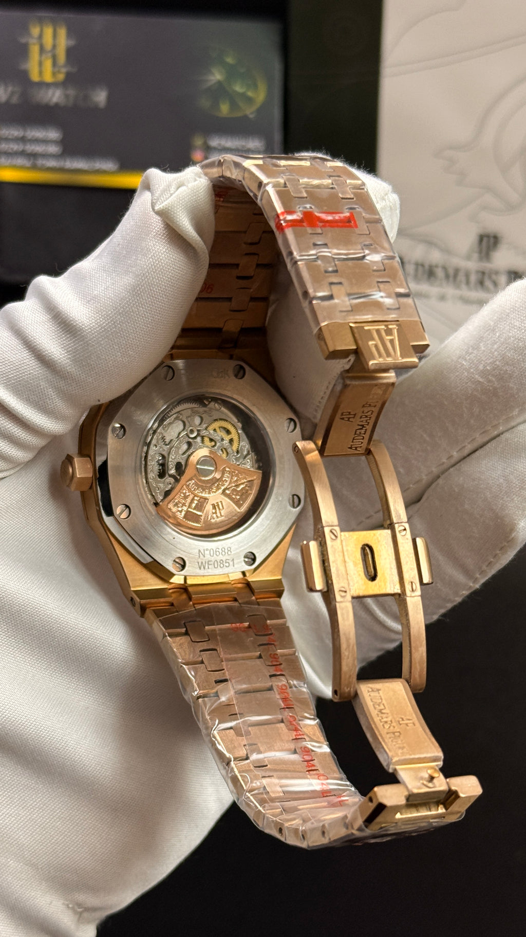 Rose gold with black skeleton dial