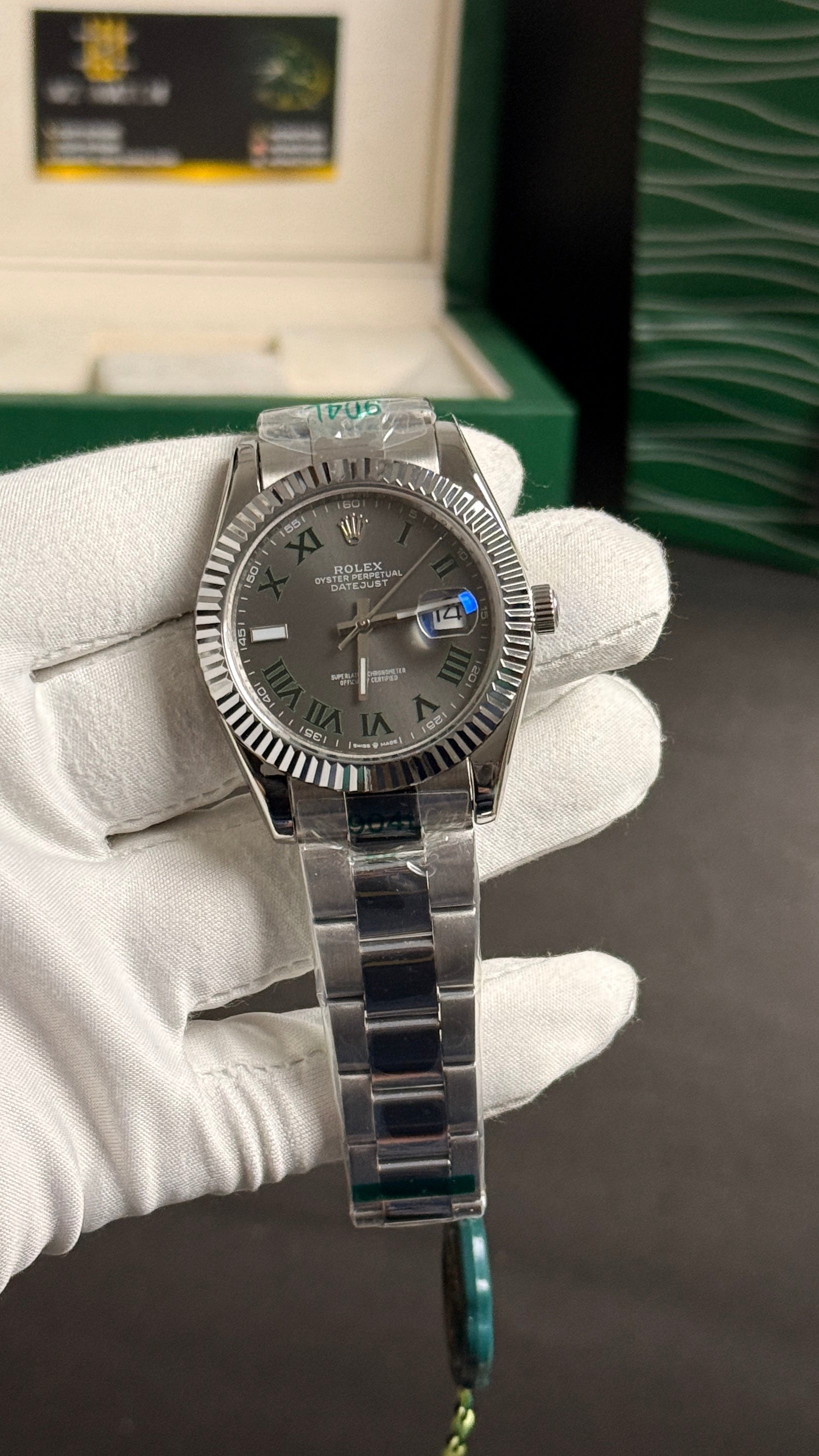 Silver with grey Dial.