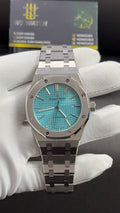 Silver with Tiffany blue dial