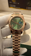 Rose Gold with green Dial.
