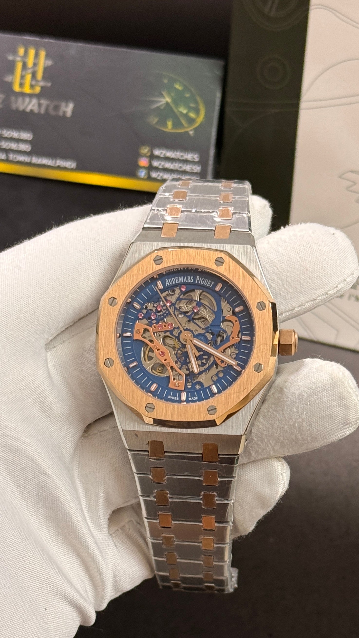 Rose gold two tone with blue skeleton dial