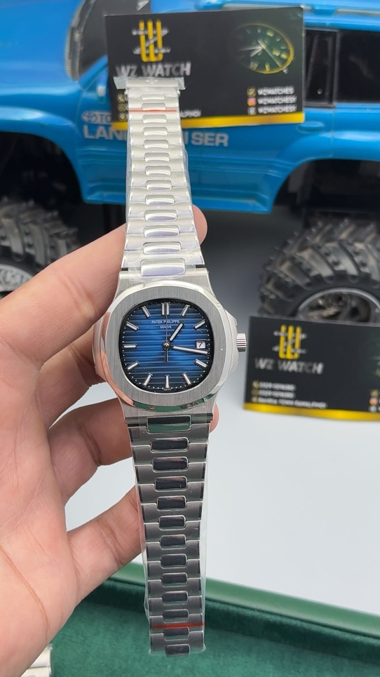 Silver with blue Dial.