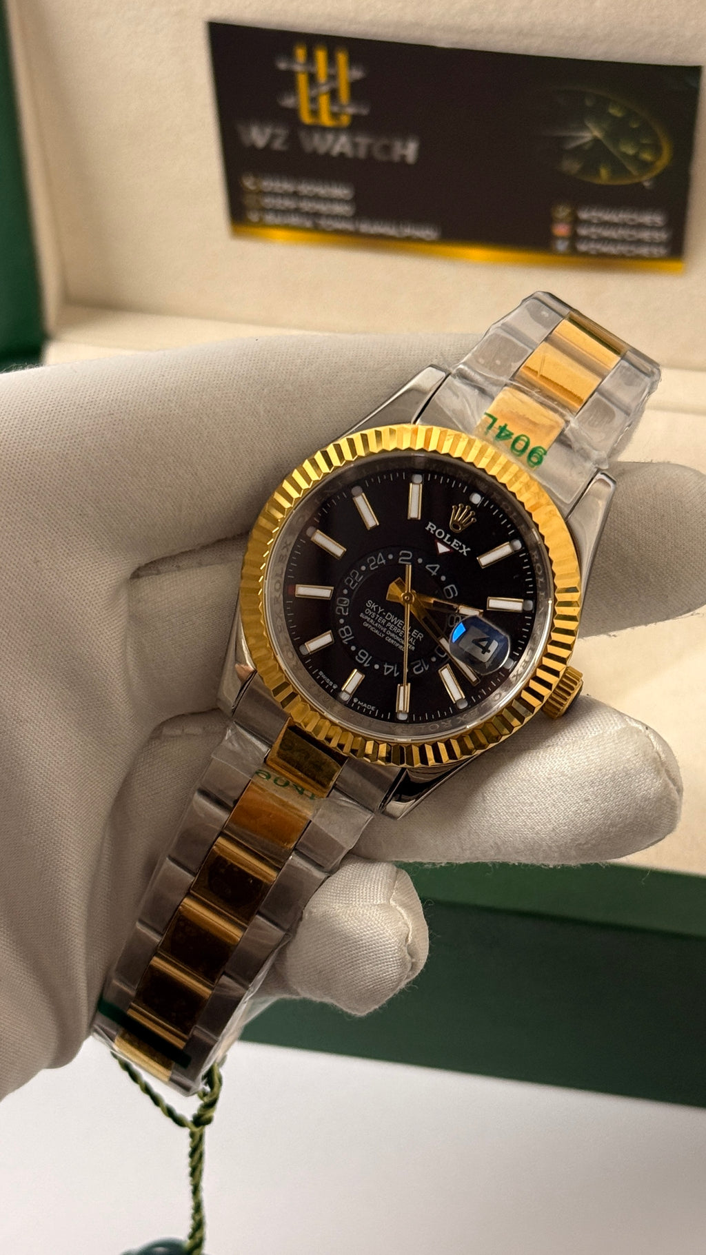 Yellow gold two tone with black Dial.