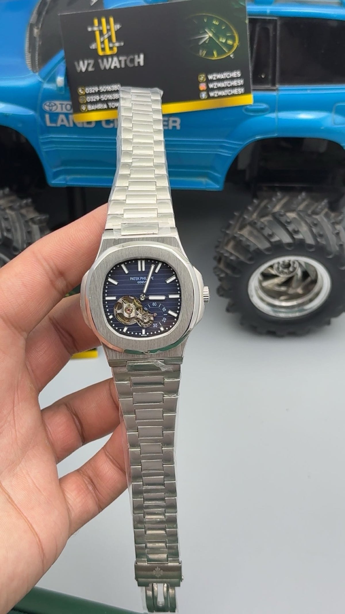 Silver with blue Dial.