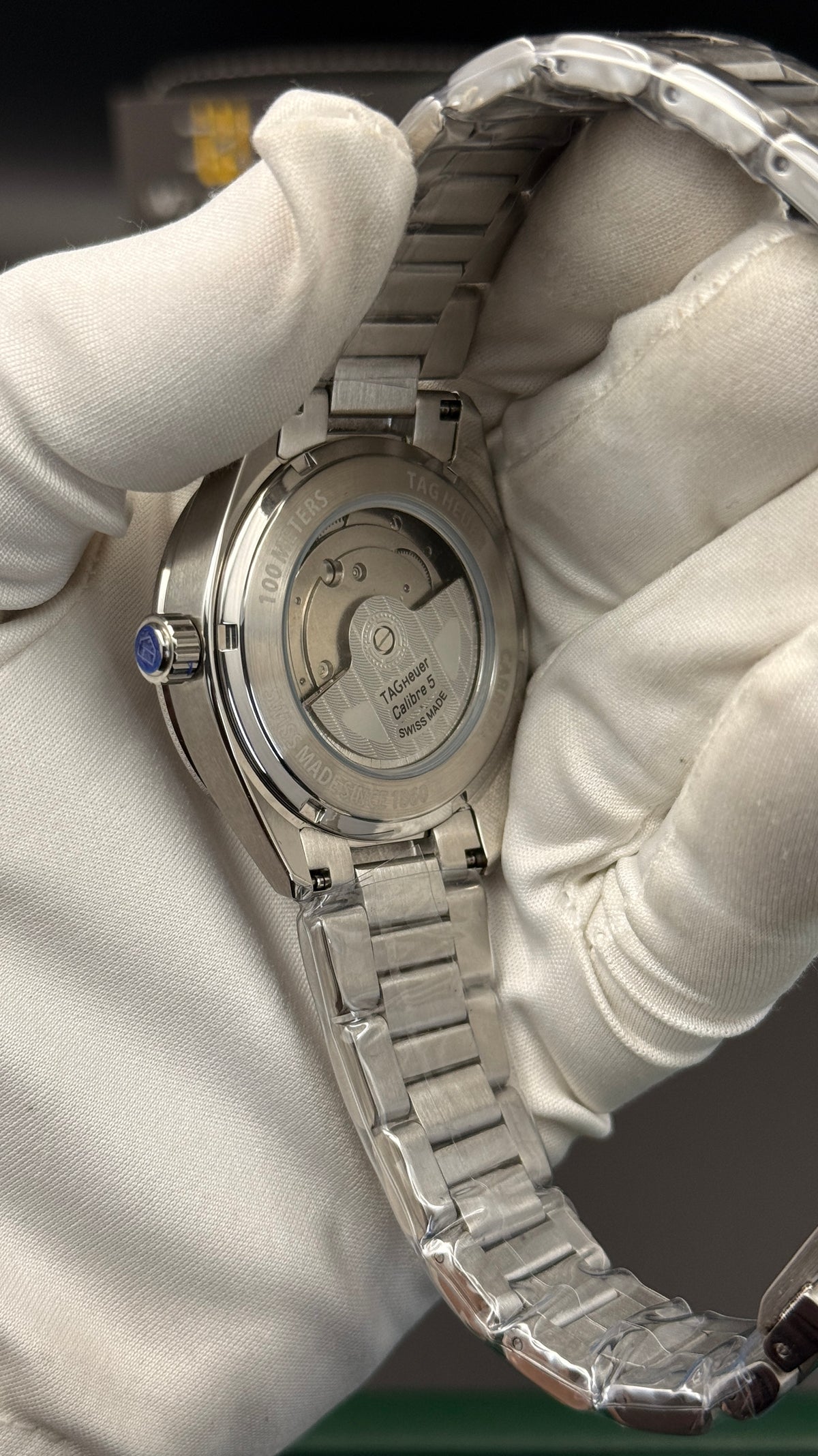 Silver with blue Dial.