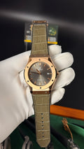 Rose gold with gray Dial.
