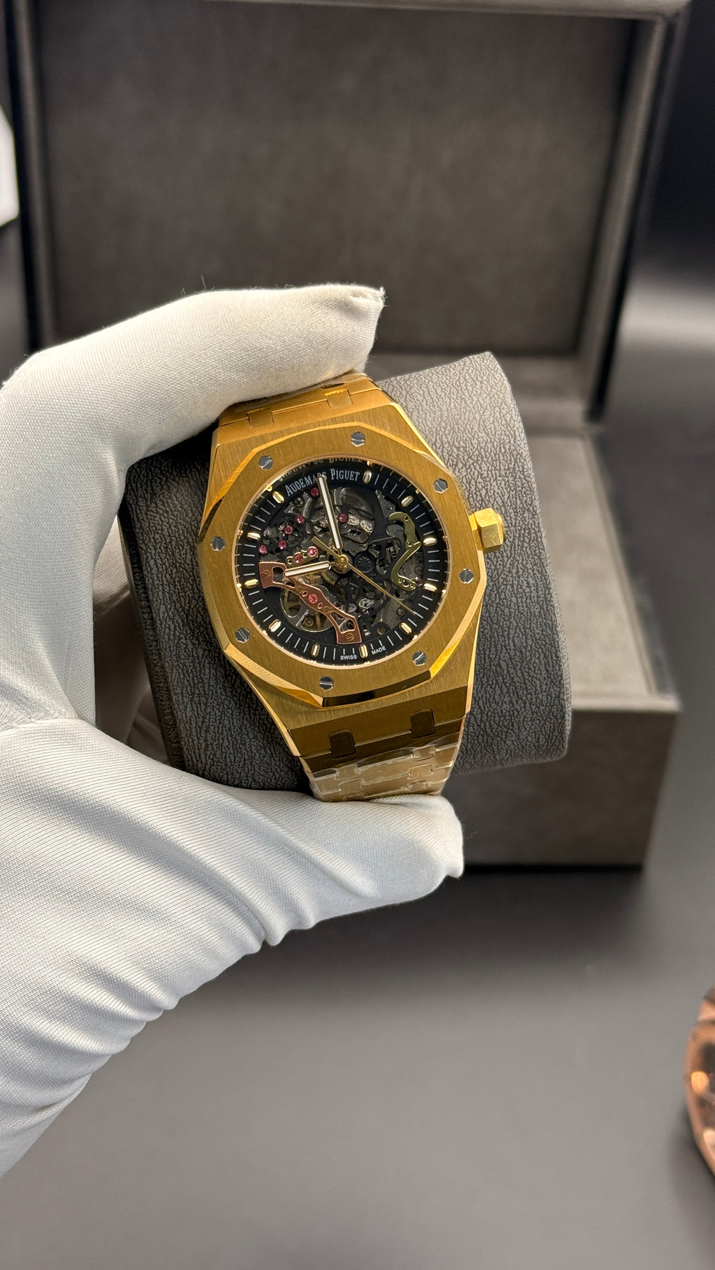 Yellow gold with black skeleton Dial.