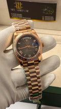 Rose Gold with grey Dial.