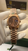 Rose gold with chocolate Dial.