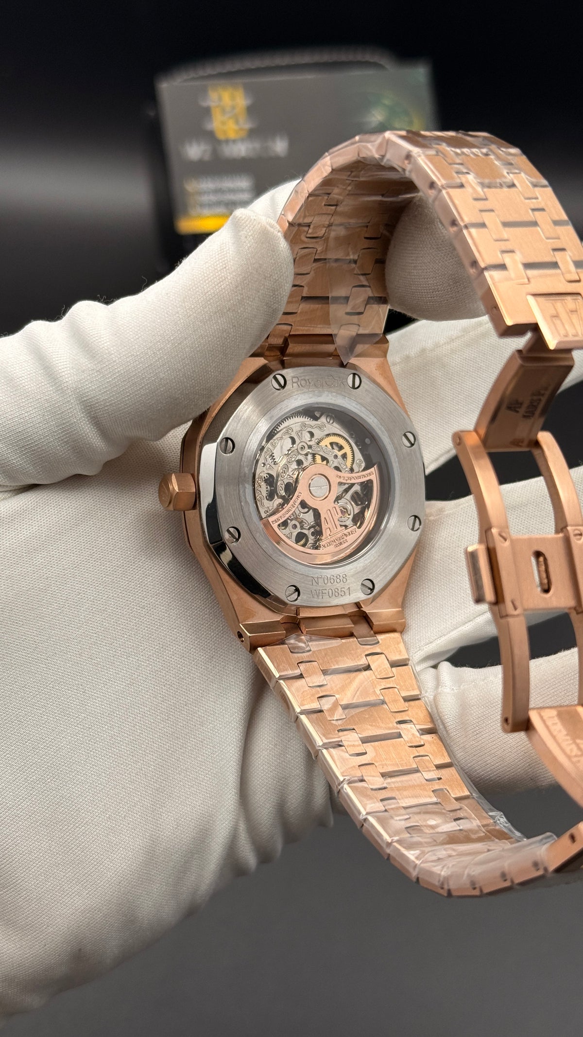 Rose gold with white  skeleton Dial.