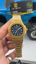 Gold with blue Dial.