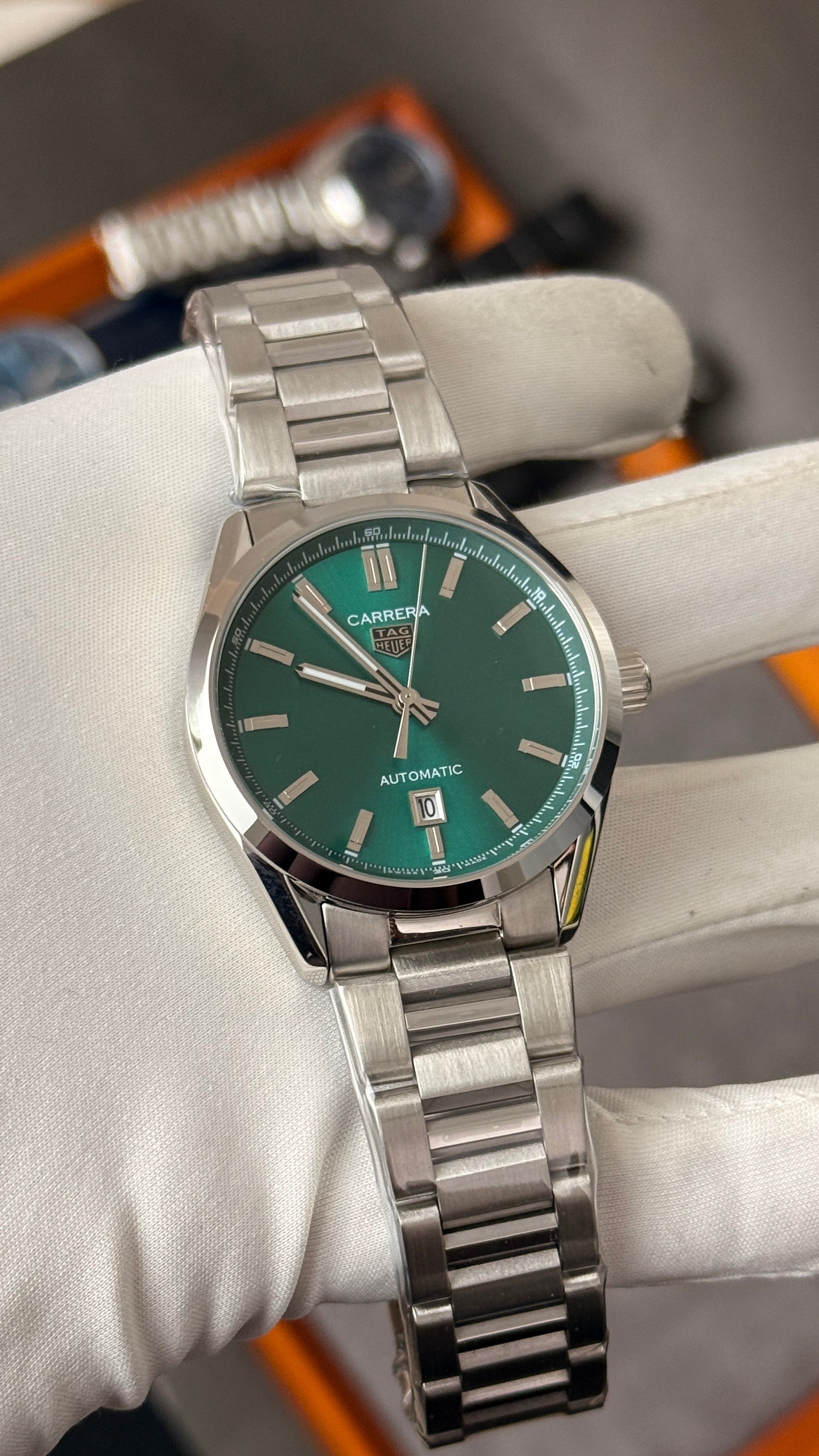 Silver with green Dial