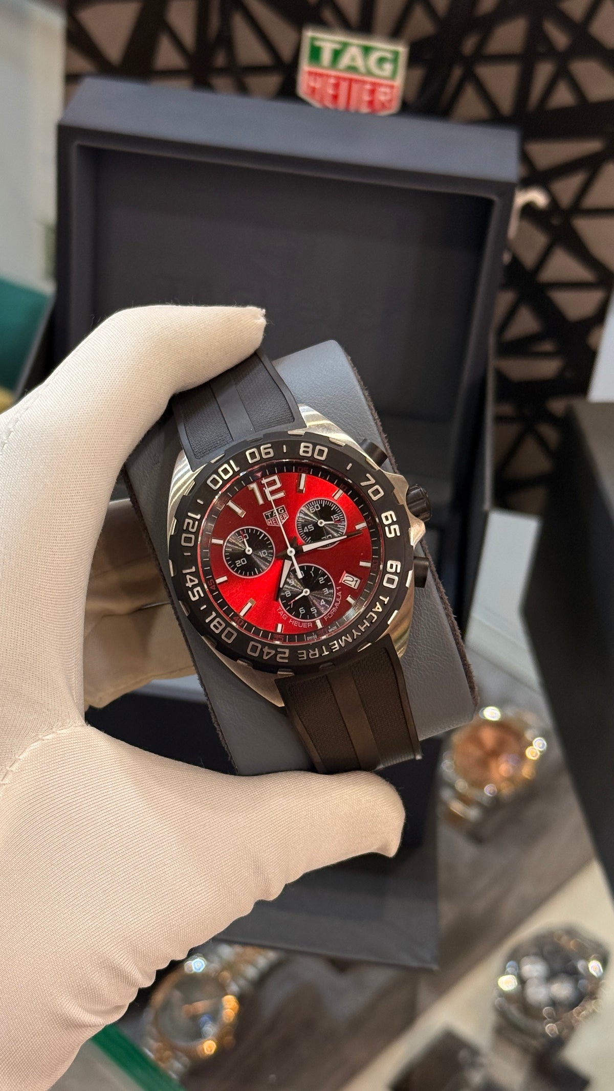 Silver with maroon Dial.