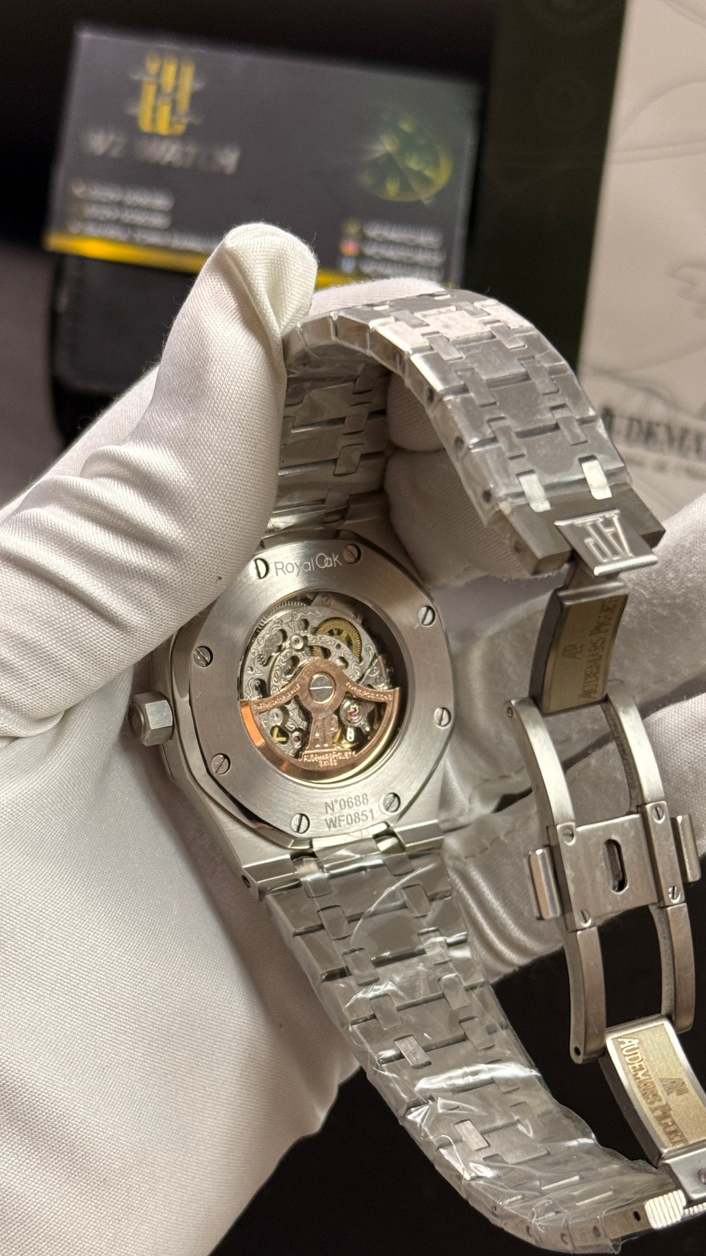 Silver with orange skeleton dial