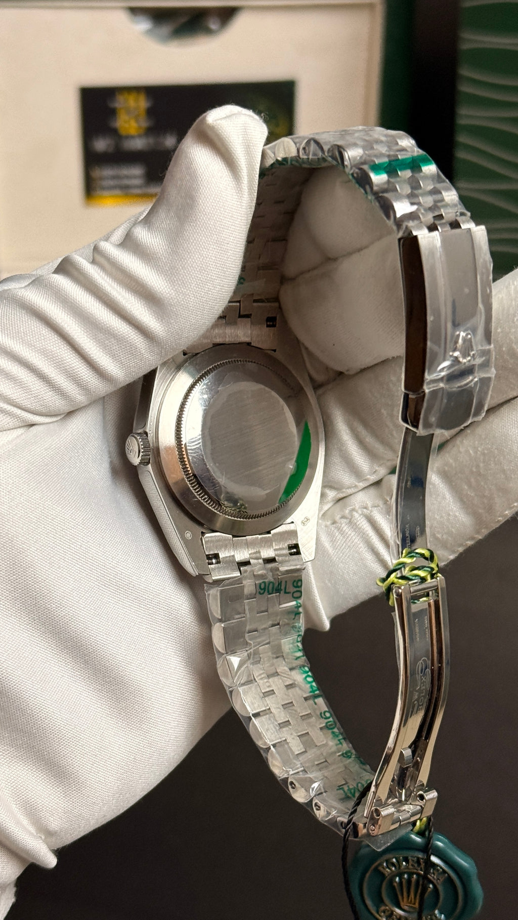 Silver with green Dial.
