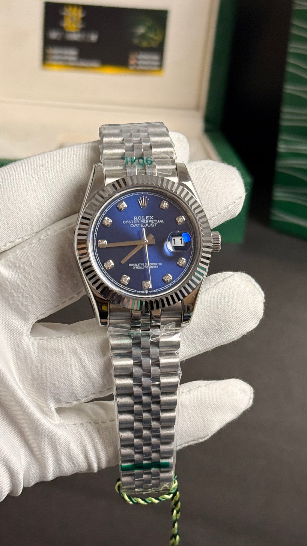 Silver with blue Dial.