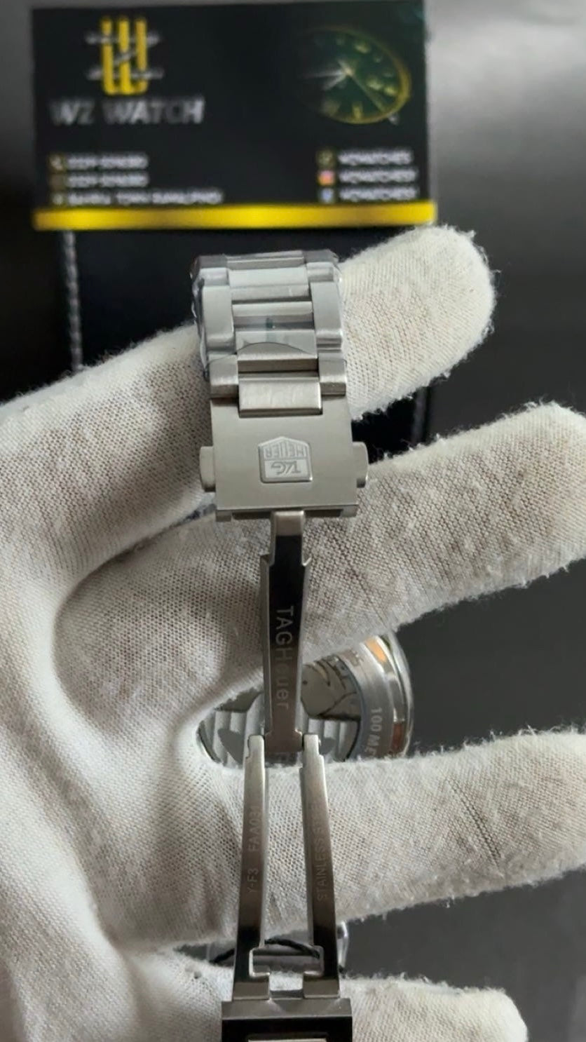 Silver with green Dial