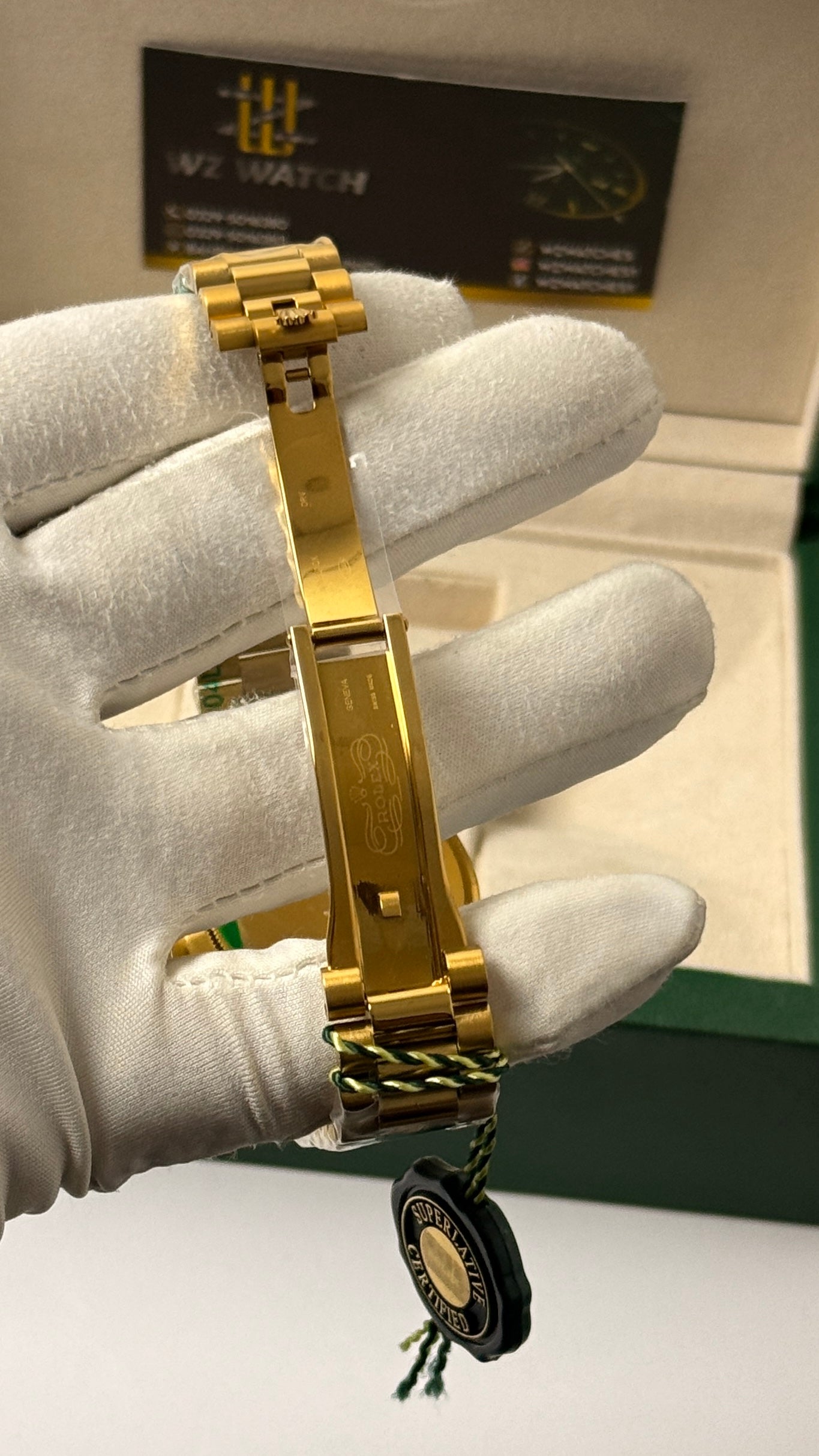 Yellow Gold with green Dial.